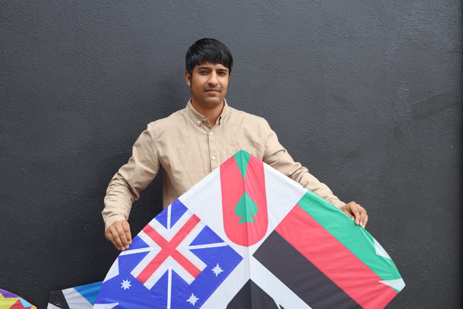 Refugee flying a kite for his future